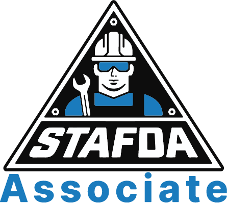 Man in hard hat holding wrench inside triangle